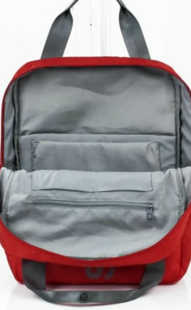 Designed by custom backpack manufacturers, this versatile red bag features interior pockets and sturdy grey top handles.
